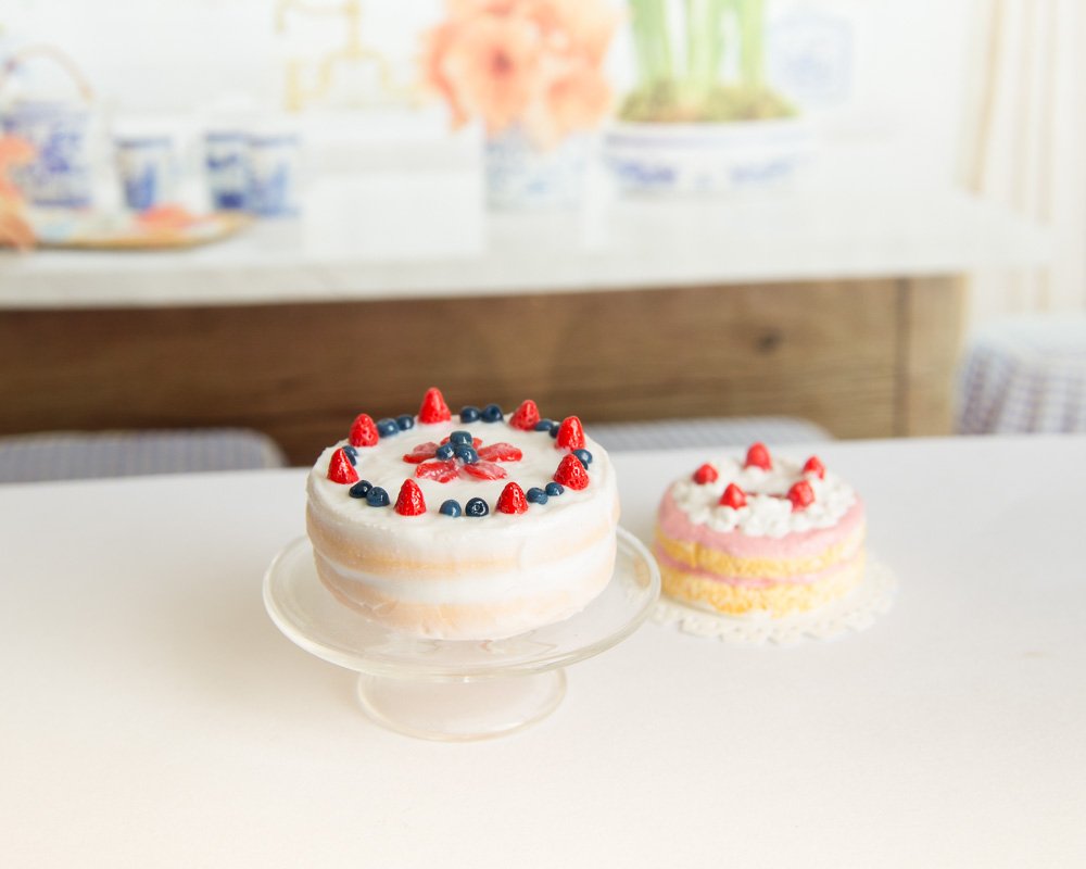 Homemade strawberry and blueberry cake. Dollhouse miniature in 1/12 scale